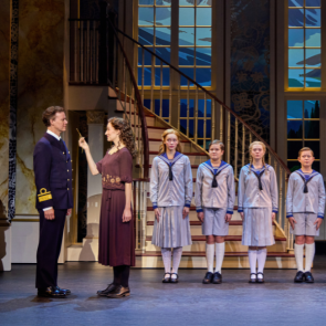 Kevin Earley (Captain Georg von Trapp) and Cayleigh Capaldi (Maria Rainer) with the von Trapp Children (l to r) Ariana Ferch (Liesl), Eli Vander Griend (Friedrich), Ava Davis (Louisa), Benjamin Stasiek (Kurt), Haddie Mac (Brigitta), Ruby Caramore (Marta), Luciana VanDette (Gretl) in The Sound of Music. Photo by Jeremy Daniel. 